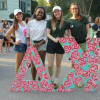 Members of Kappa Delta holding their letters while preparing for a homecoming parade.